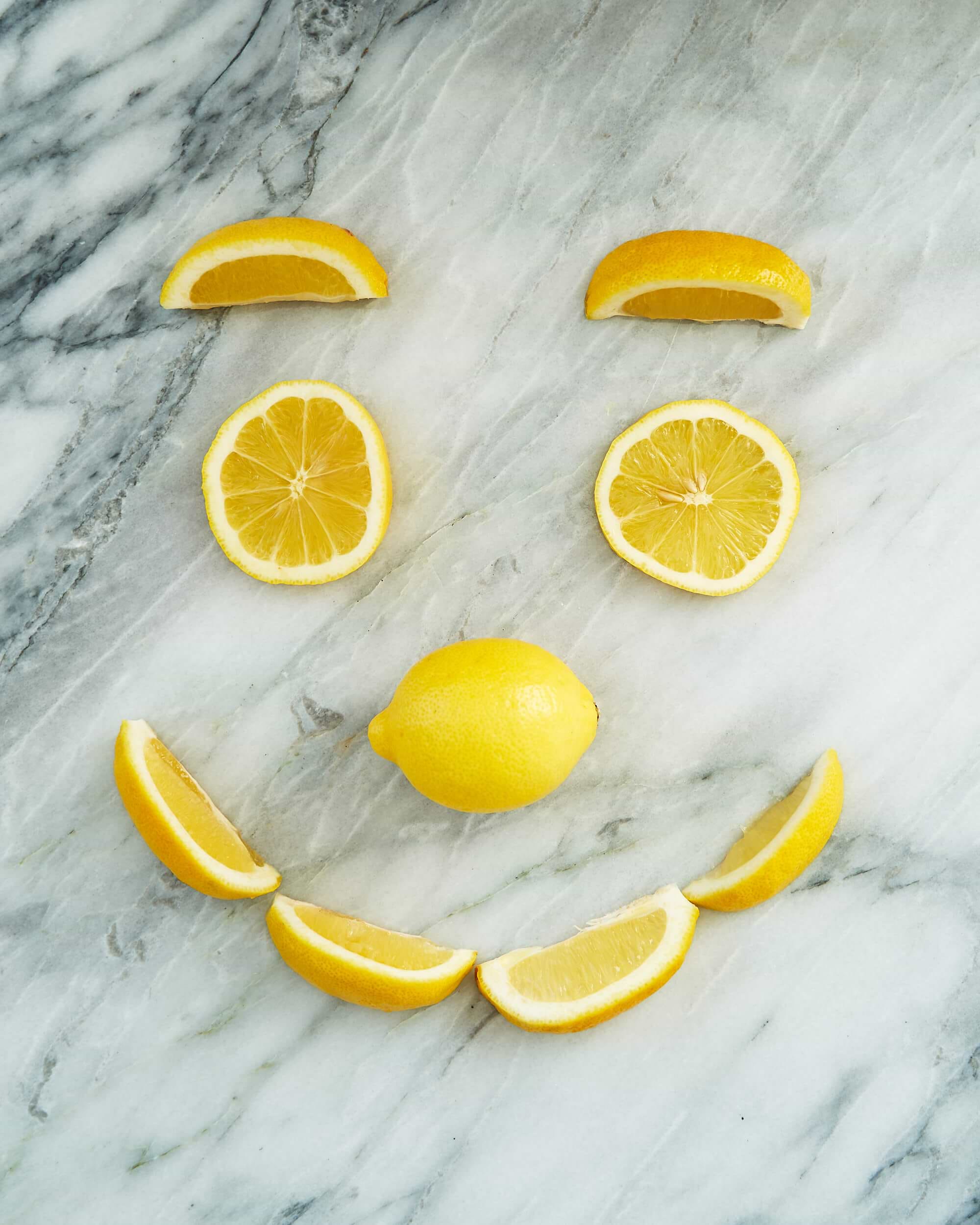 Lemons cut and displayed on a marble counter