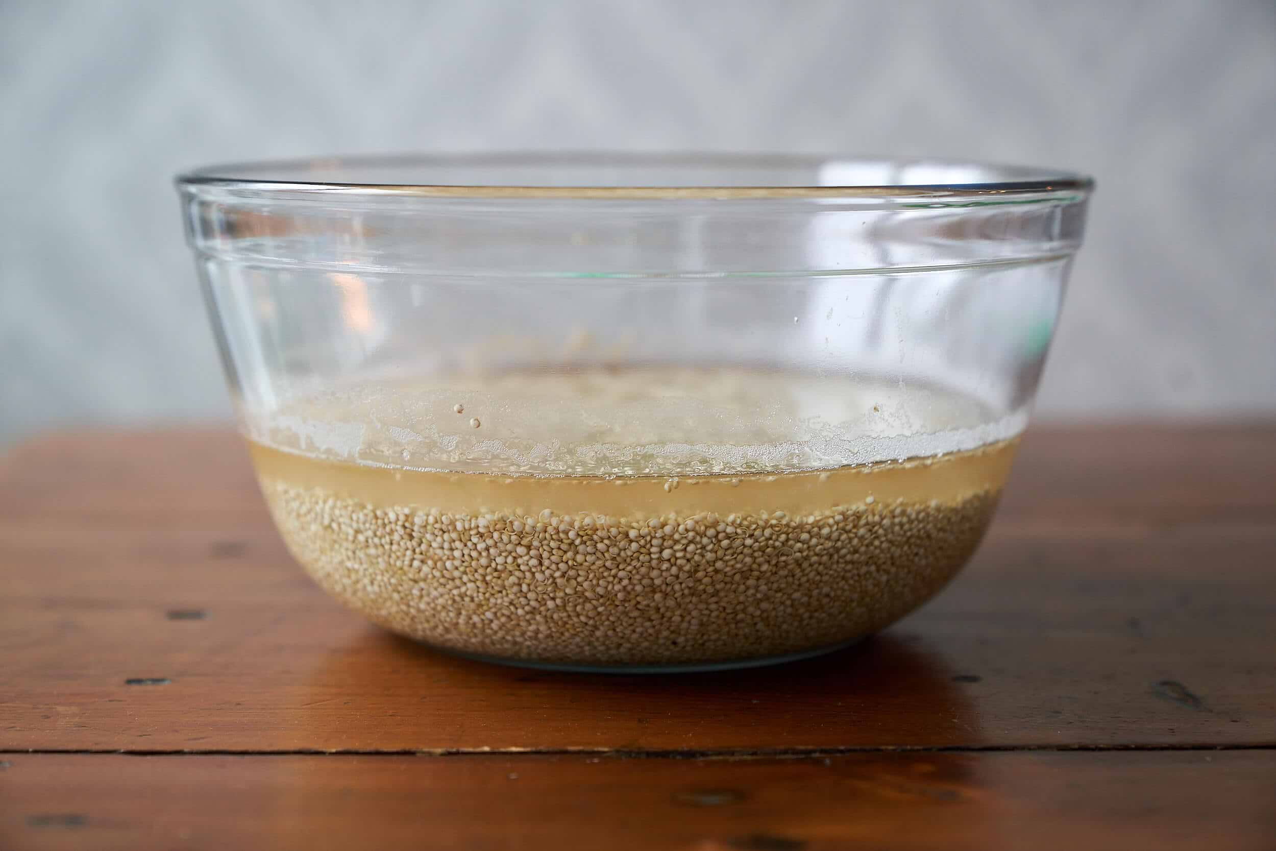 quinoa soaking in glass bowl