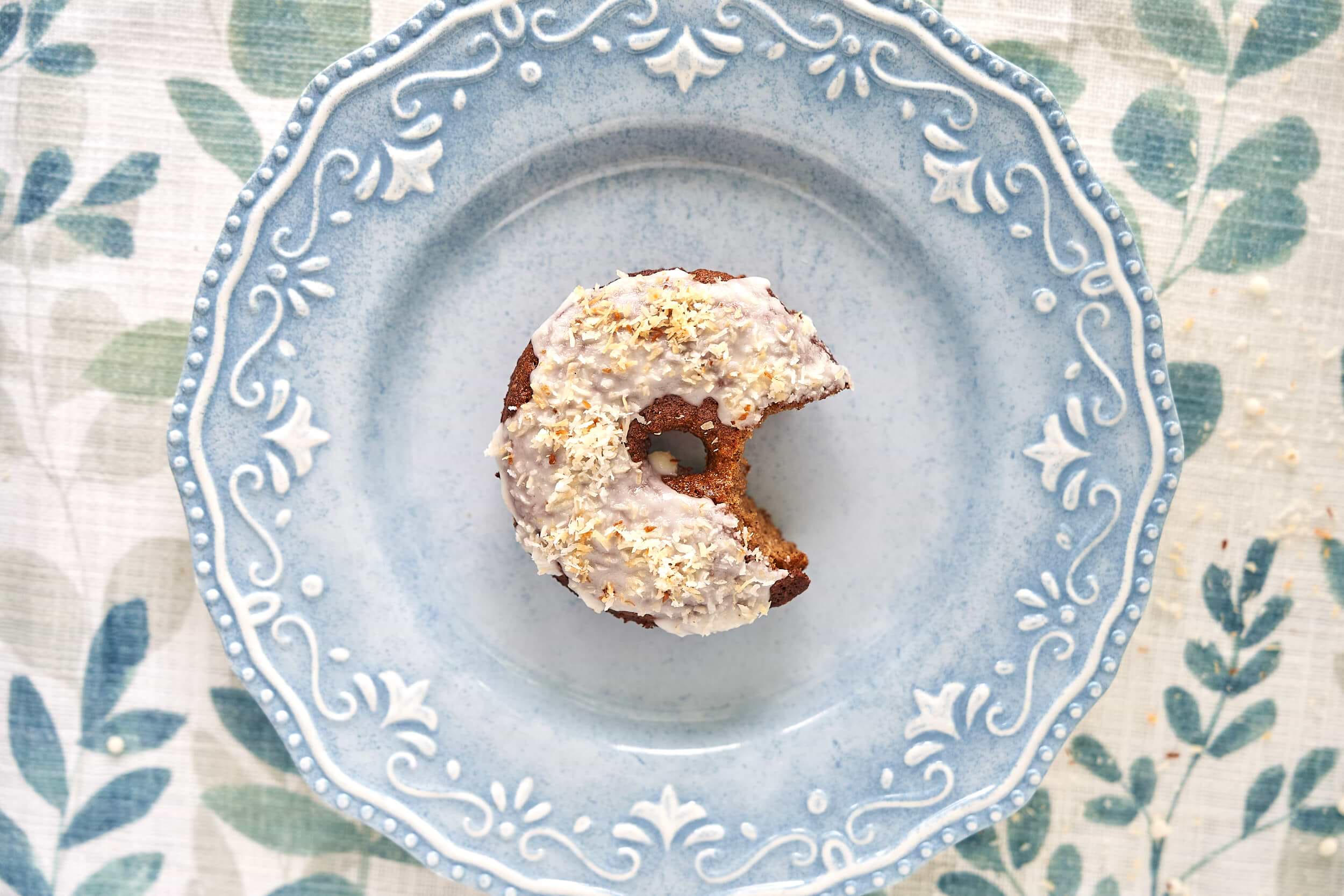 Gluten-free donut on a blue plate.