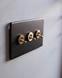 Soho Lighting Matt Black & Brushed Brass 20A 3 Gang Intermediate Toggle Screwless