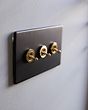 The Camden Collection Matt Black & Brushed Brass 20A 3 Gang 2 Way Toggle Switch Screwless
