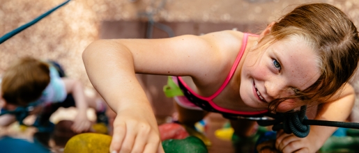 Girl climbing the wall