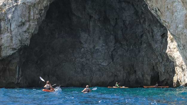 Exploring the caves by sea kayak