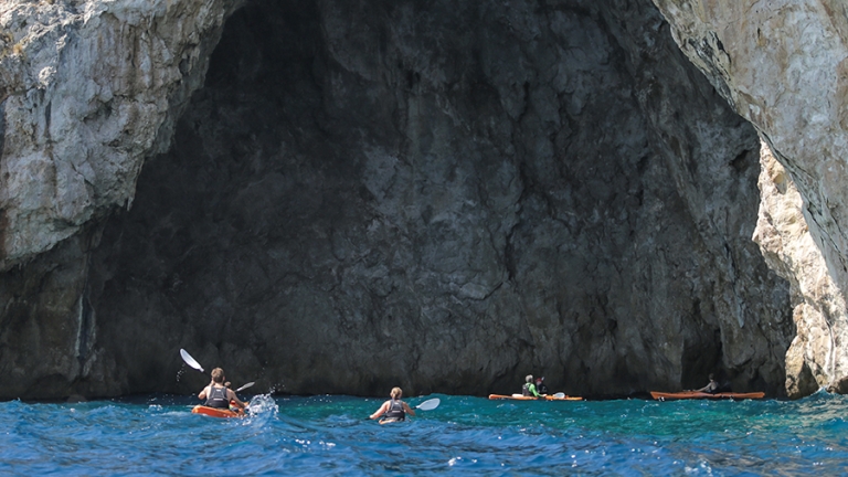 Exploring the caves by sea kayak