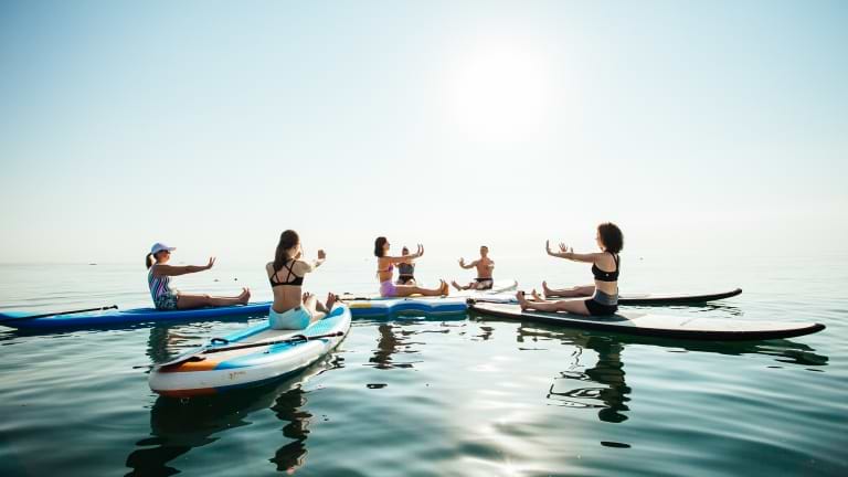 Sunrise and sunset SUP yoga at Neilson | Cook's Club Adakoy