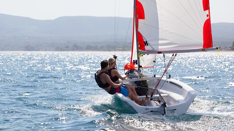 Couple enjoying the sailing at Messini Beach Club