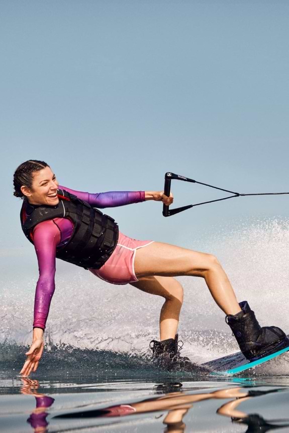 Woman wakeboarding in Greece