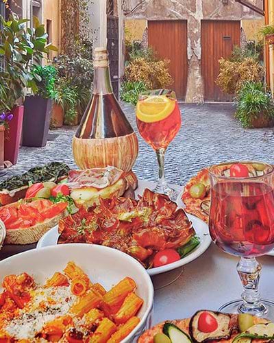 Italian food and drink on a restaurant table