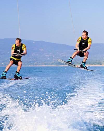 Jumping the boat wake on a wakeboard