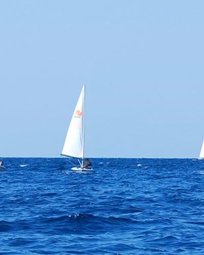 Group of people sailing dinghies