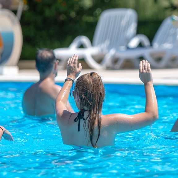 group of people doing aqua fit in swimming pool