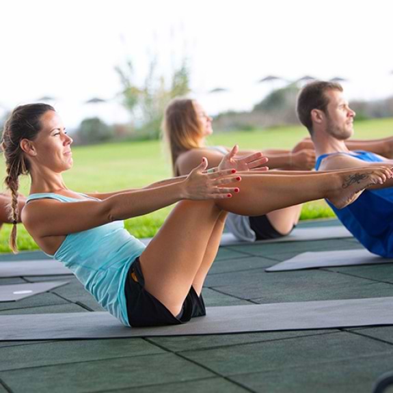Woman doing yoga outdoors