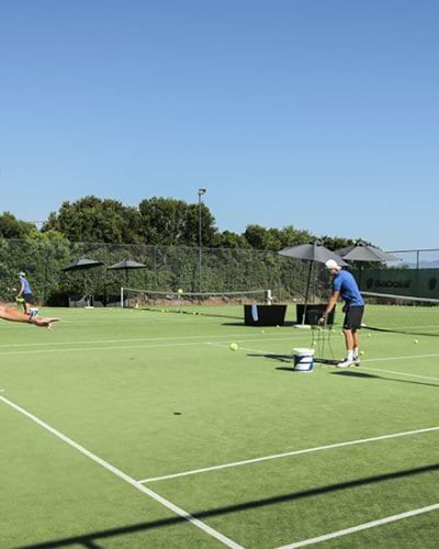 men and women paying doubles tennis