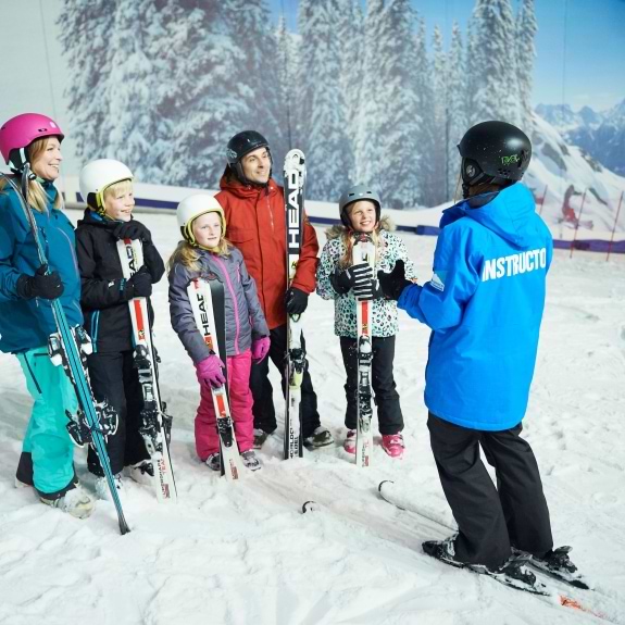 group learning to ski at indoor snow dome