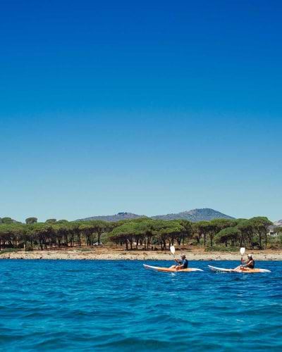 Two people kayaking in Sardinia