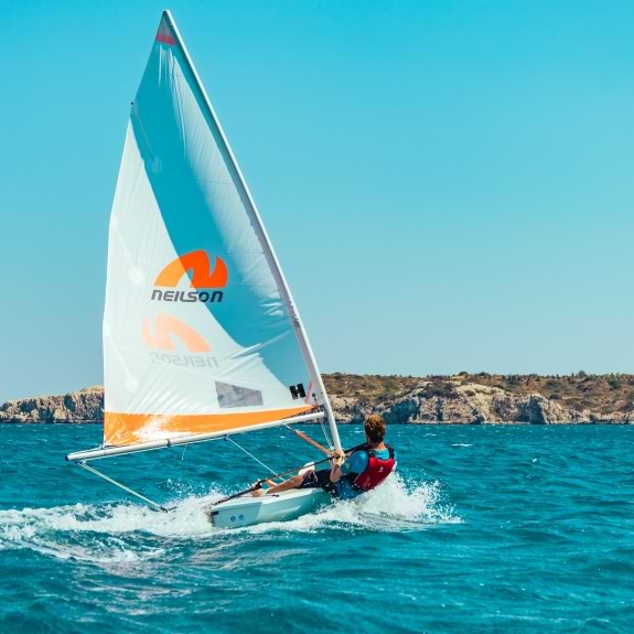 dinghy sailing at levante beach club