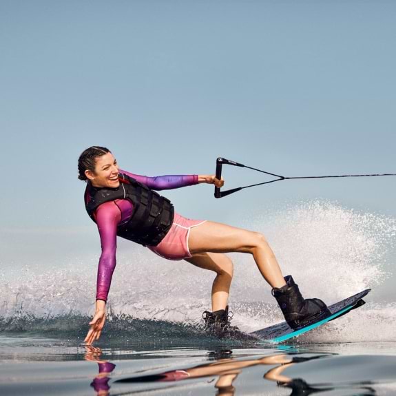 Woman wakeboarding in Greece