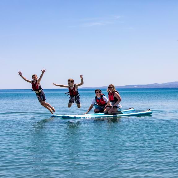 Paddle boarding fun at Messini Beach Club
