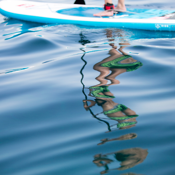 Blue seas, paddle boarding