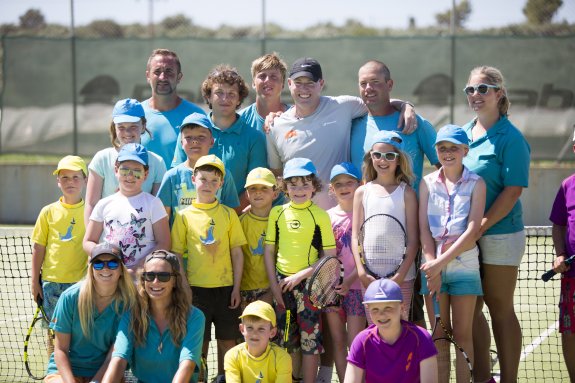 Group of children on tennis court
