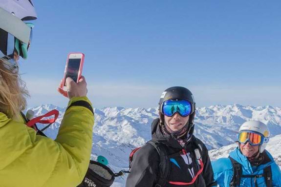 People posing for photo on a mountain in Val Thorens