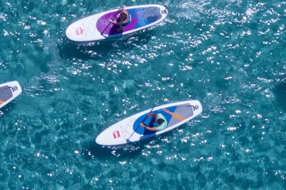 aerial view of group stand up paddle boarding