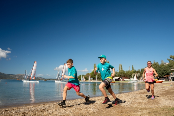 Kids running on a beach