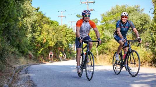 Two men road cycling on holiday