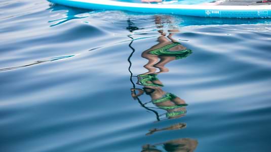Blue seas, paddle boarding