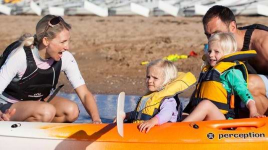 A family on a kayak