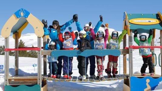 Family at a ski resort playground