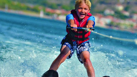 A boy wakeboarding