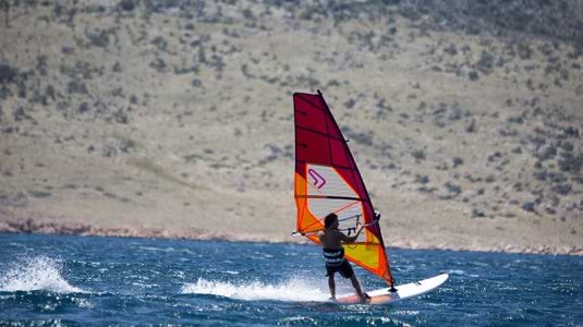 Man on a windsurfing board