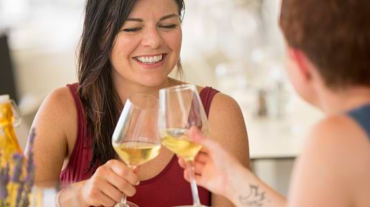 Two people drinking wine