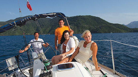 people sailing a yacht