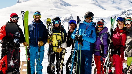 group of skiers and snowboarders