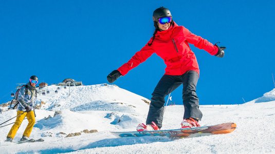 Snowboarder in red jacket