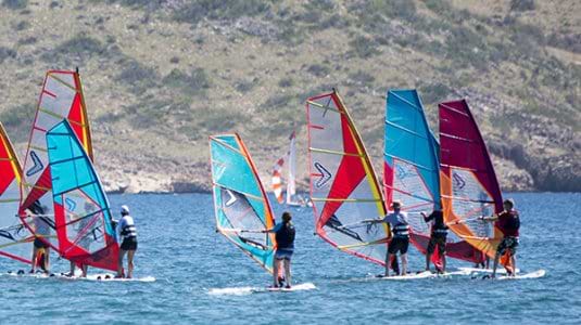 a group of people windsurfing in Croatia