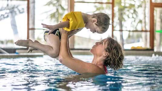 mum and son in pool