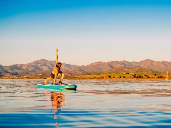 Yoga on a paddle board in Sardinia