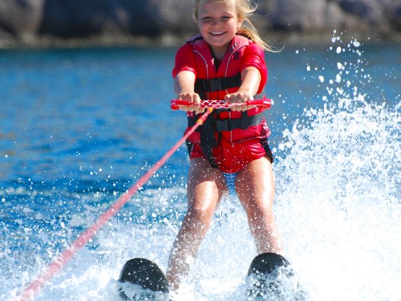 young girl waterskiing