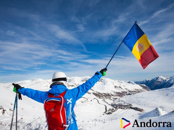 skier holding the Andorra flag
