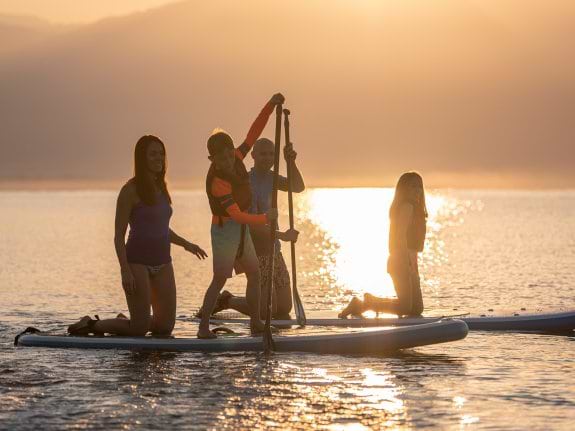 Family on paddle board