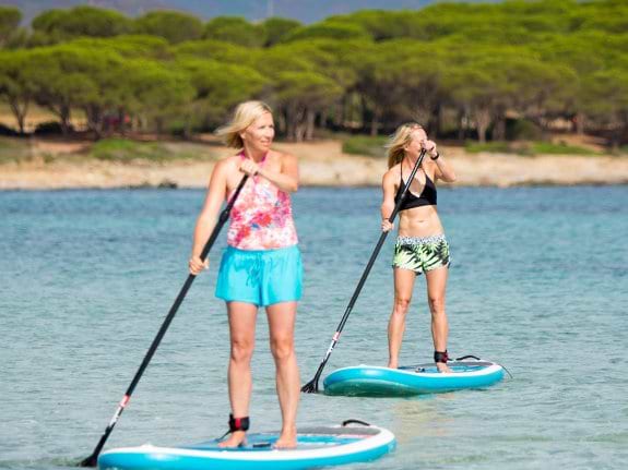 2 people on stand up paddle boards