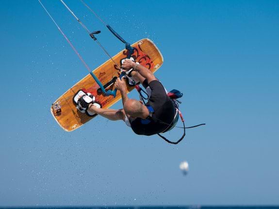 man kitesurfing on holiday in Sardinia