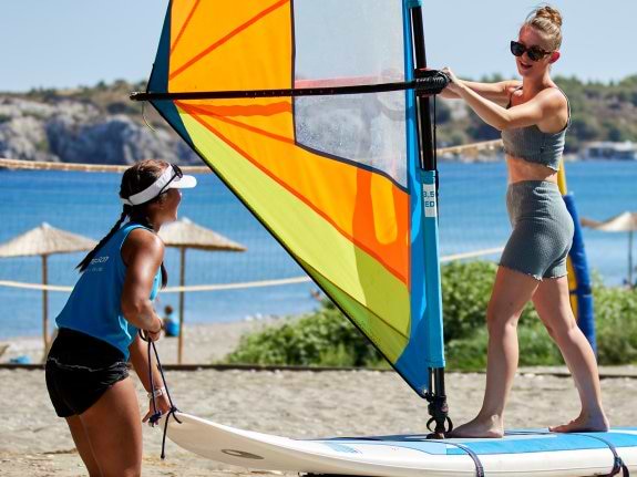 woman learning to windsurf