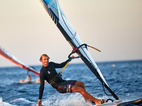 mann windsurfing in Greece
