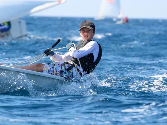 young boy dinghy sailing