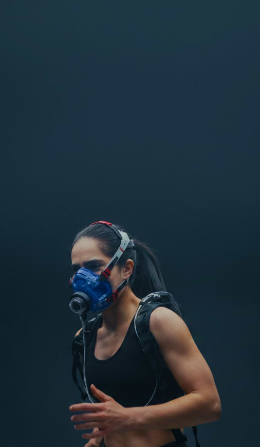 Athlete wearing a metabolic CPET mask during VO2 max testing.
