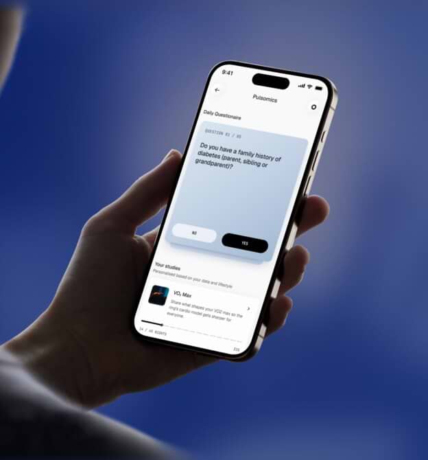 A hand holding a phone showing the Pulsomics onboarding questions